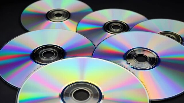 Shiny Compact Discs and DVDs with Iridescent Reflections