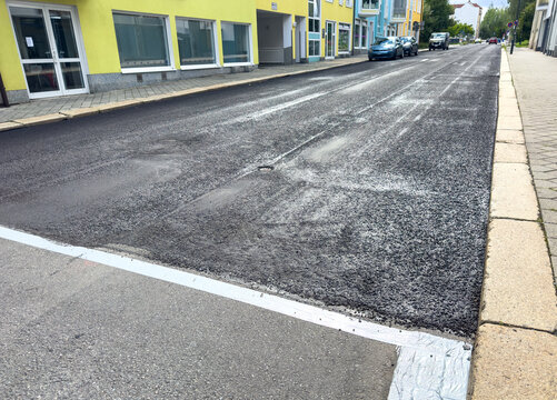 Road Surface Being Resurfaced with Fresh Asphalt &ndash; Road Construction and Infrastructure Repair