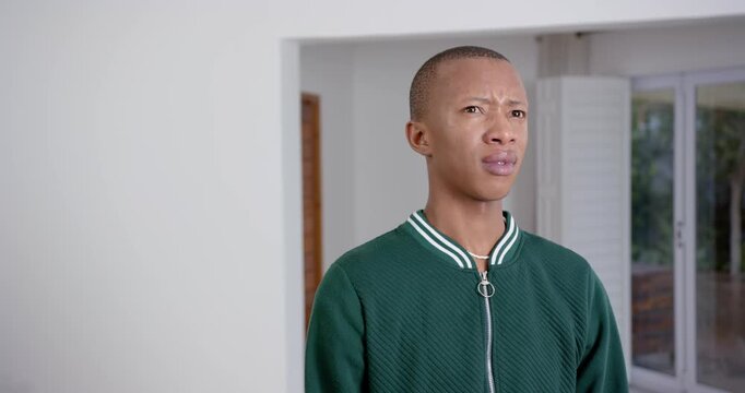 High speed photography for dynamic scenes, man in green jacket looking confused and raising eyebrows