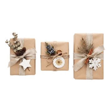 Three elegantly wrapped gifts with natural decorations isolated on transparent background