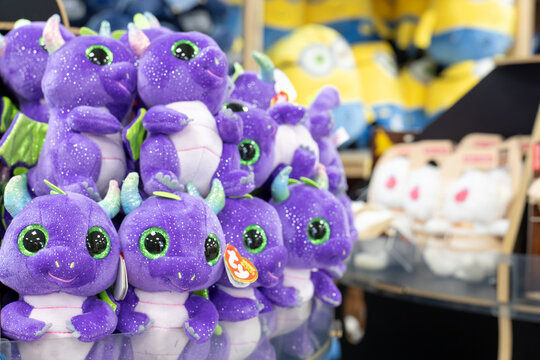 Purple Ty dragon plush toys with large green eyes displayed for sale inside store. Kaliningrad, Kaliningrad Region, Russia. September 15, 2026.
