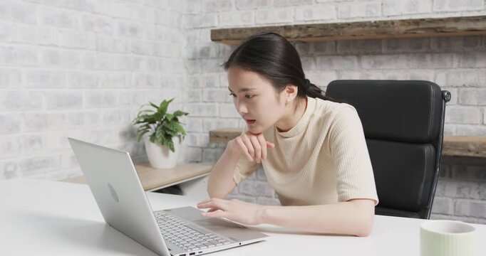 Lifestyle videos indoor of people doing activities at office, typing on laptop, woman working at des