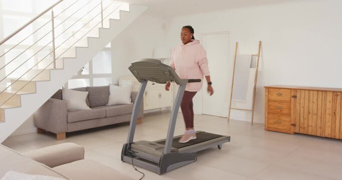 Lifestyle videos indoor of people doing activities at home, exercising on treadmill, woman in pink h