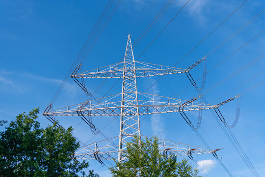 High voltage. Electricity power pylon. Electricity tower. Electrical energy. Power transmission tower at cloudy sky. Electricity power lines and sky. Green energy. Electric voltage station