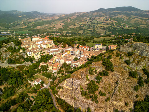  Wide high-angle aerial view over the hillside village of Pennabilli