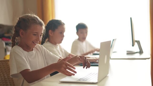 children learn from home through computers. business concept of modern training and development. group of little kids perform tasks in a laptop at home schooling. educating from lifestyle home