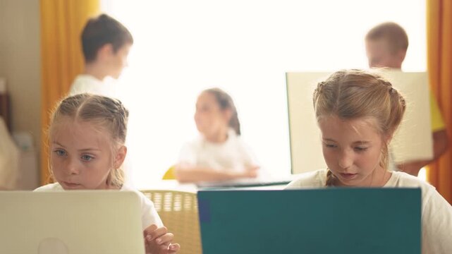 children learn from home through computers. business concept of modern training and development. lifestyle group of little kids perform tasks in a laptop at home schooling. educating at home