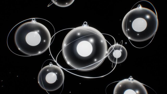 Futuristic glass sphere ornaments with orbiting rings and illuminated cores float in deep black space in a sleek 3D animation
