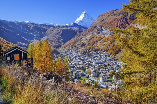 View from the hamlet of Ried down into the valley to the village and the Matterhorn 4478m in autumn, Zermatt, Mattertal, Valais, Switzerland