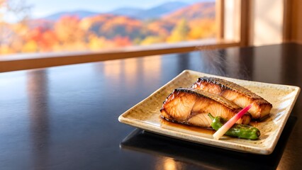 Obraz premium 黄瀬戸の角皿に盛ったぶりの照り焼き 紅葉の窓辺の座卓で味わう秋の和食