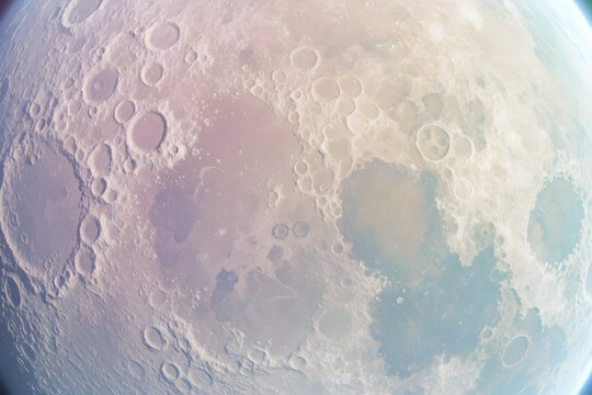 A cratered planet surface seen from orbit overhead flat lay viewed
