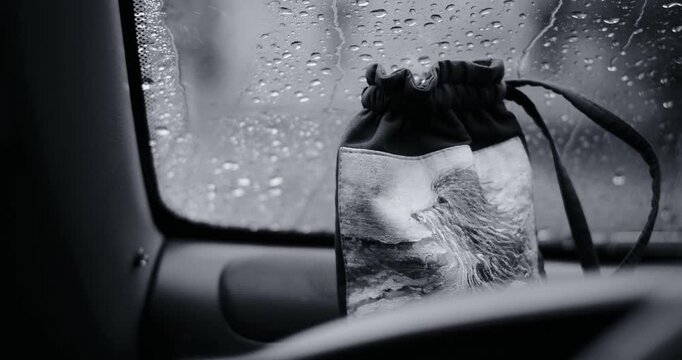 Cinematic black and white footage highlighting heavy rain and detailed raindrops. This moody monochrome video features wet surfaces and dark atmosphere, good for dramatic or melancholic concepts.