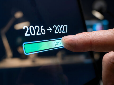 Finger adjusting year change slider from 2026 to 2027 on digital interface