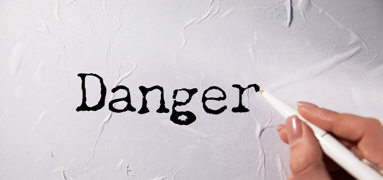 Danger word written on paper
