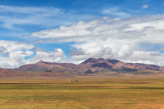 Tibetan plateau landscape with grassland and mountains