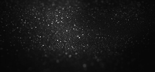 Obraz premium Glowing silver glitter particles. Defocused shimmering dust texture with bokeh effect. Christmas Starry night sky or a magical, festive texture.