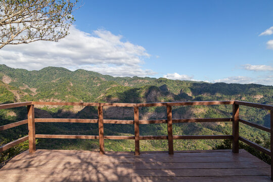 Wooden viewing platform at Mirador El Mulo overlooking the Guayapa River valley and forested mountains of El Imposible National Park, Ahuachapan, western El Salvador.