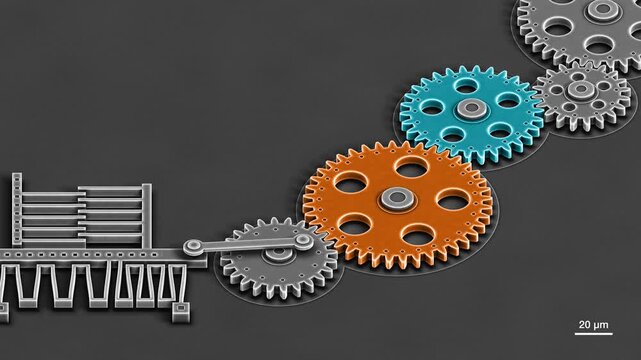 Scanning electron microscope view of a silicon MEMS micro engine, comb drive and serpentine springs turning a false color gear train, seamless loo
