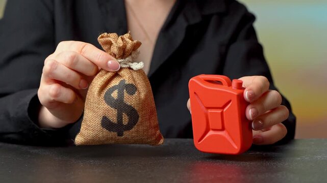 Fuel canister and dollar money bag. Gasoline and diesel prices. Fuel costs and factoring in product and service costs due to rising prices. Expense growth, pricing strategy and business profitability