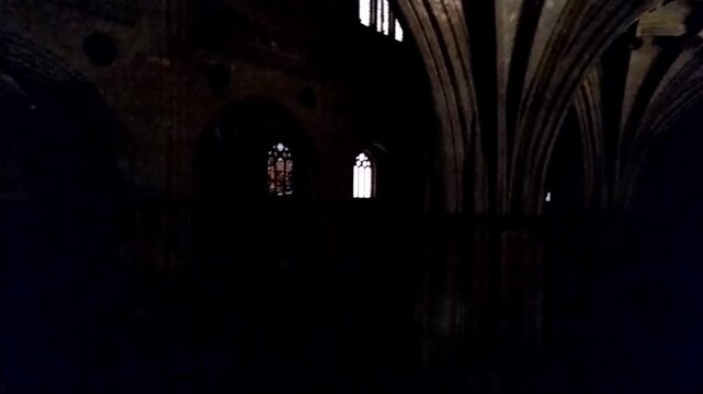 Low lighting panning motion video of the Interior nave of salamanca church, spain