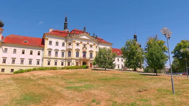 Splendid summer view of Hradisko Monastery (Klaster Hradisko). Sunny afternoon cityscape of Olomouc town, eastern province of Moravia, Czech Republic, Europe. 4K video (Ultra High Definition).