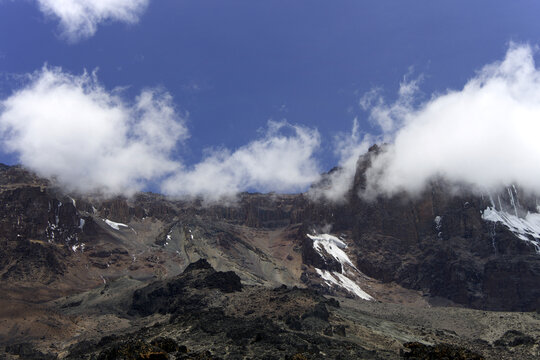 Kibo summit of Mount Kilimanjaro with glaciers and clouds, Tanzania