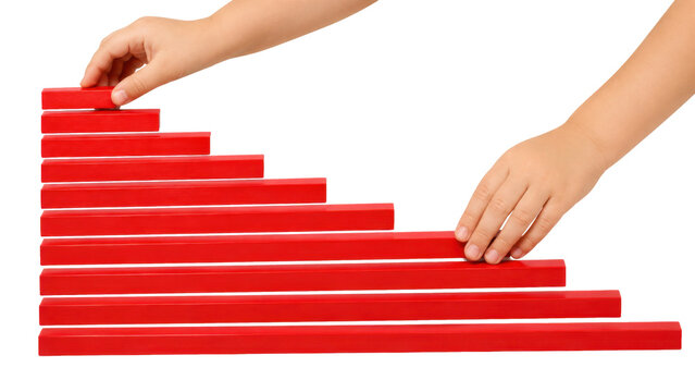 Montessori red rods, hands arranging painted wood bars in ascending length order, no branding isolated. Montessori sensory aid isolated on white background.