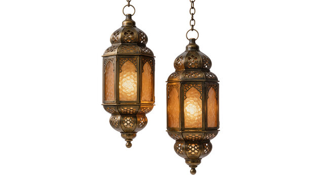 Two ornate brass Moroccan lanterns with amber glass panels illuminated, isolated on transparent background