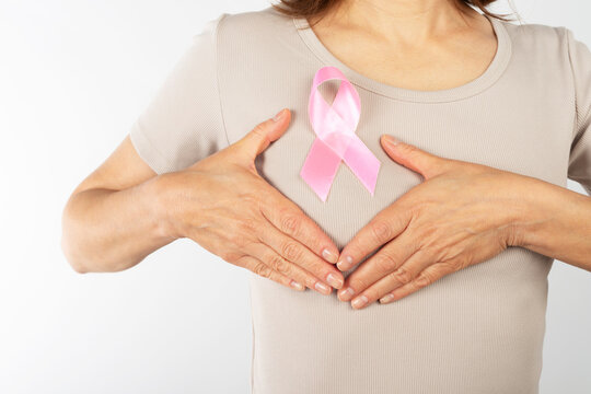 Caucasian Woman Wearing Pink Ribbon for Breast Cancer Awareness