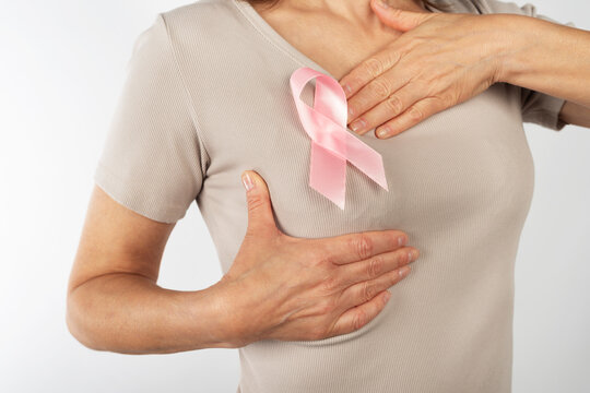 Caucasian Woman Wearing Pink Ribbon for Breast Cancer Awareness