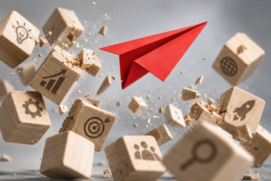 Red Paper Airplane Soaring Above Business Icons: A dynamic composition featuring a vibrant red paper airplane ascending amidst floating wooden blocks adorned with business growth icons.