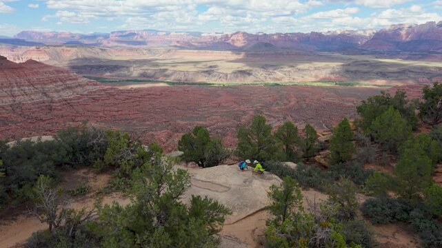 Senior couple hikes on Aerial views of man and woman hiking Gooseberry Mesa in Utah, taking in the views of Zion National Park.