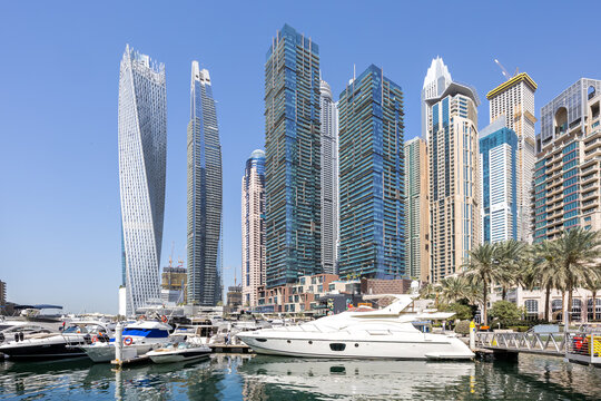 Dubai Marina skyline cityscape with yachts hotel skyscraper buildings living at water in Arabia