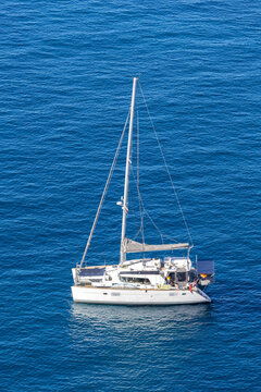 Catamaran sailing on blue ocean water on Gran Canaria island adventure holiday in Puerto de Mogan, Spain