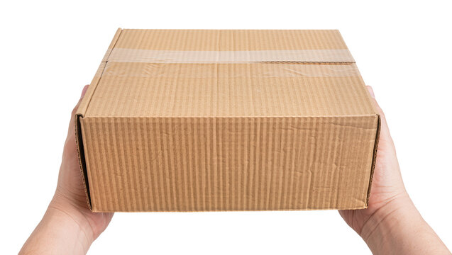 Hands holding a closed corrugated cardboard box with tape, isolated on transparent background