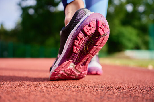 Close up of running shoe sole on stadium track
