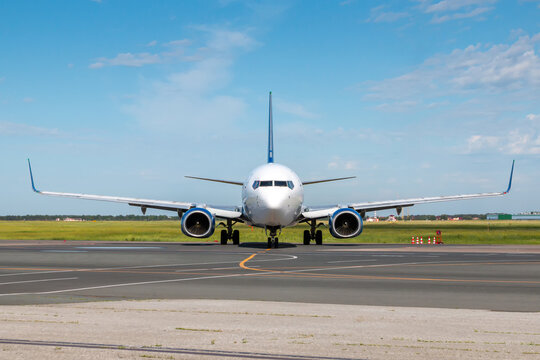 Front view modern passenger airplane at the airport