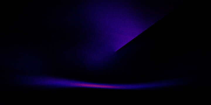 Abstract dark backdrop with sharp purple geometric light creating dramatic modern effect.