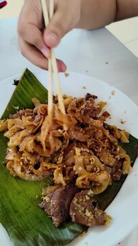 Stir Fried Flat Rice Noodles Served on Banana Leaf