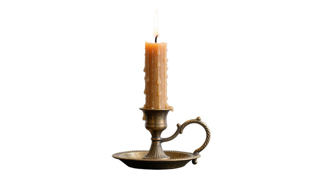 Burning beeswax candle in antique brass candlestick holder, isolated on transparent background