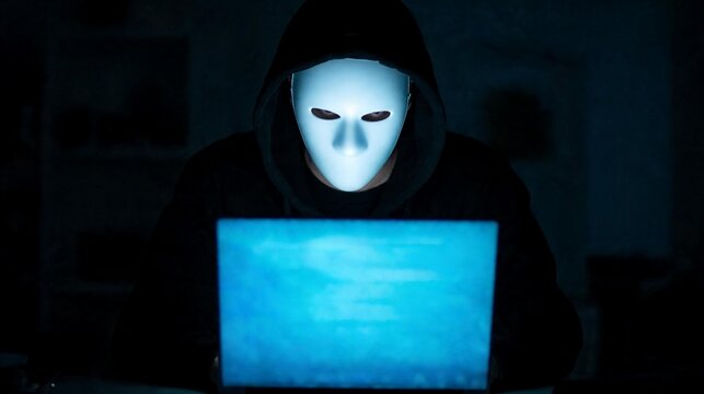 Hacker and cyber security threat, masked hacker