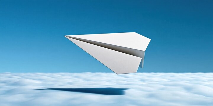 Paper plane flying high above fluffy white clouds