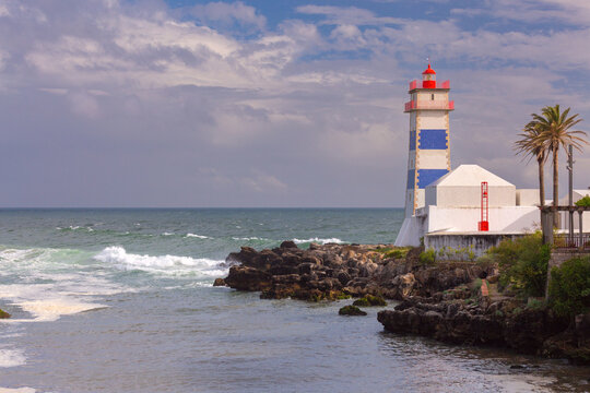 Santa Marta Lighthouse on Rocky Coast in Cascais, Portugal
