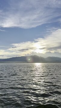 Serene Lake with Mountains at Golden Hour, Vertical Scenic View