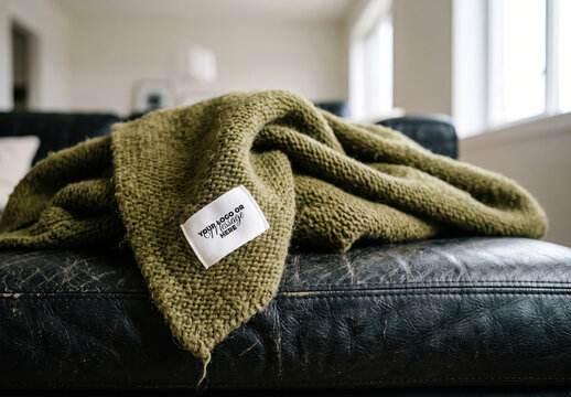 Wool Blanket Label Mockup on Leather Sofa