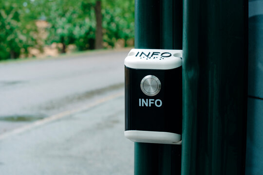 public information button beside an outdoor path