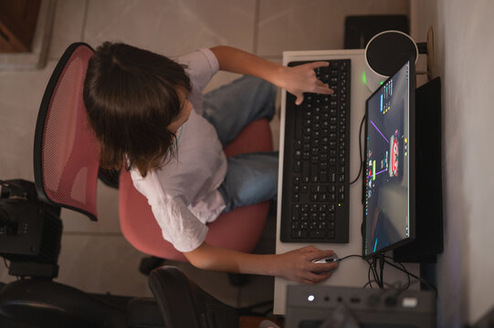 Girl kid playing game on pc