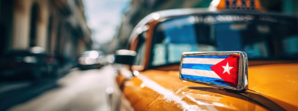 Classic taxi stands in a street with warm sunlight in Havana during day time, showcasing Cuban flag on cab