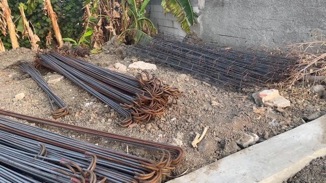 Rusty Steel Rebars and Reinforcement Mesh on Construction Site