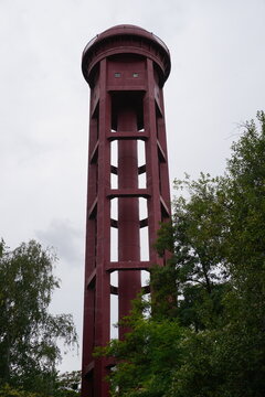 Vertical image of the historic red water tower in Natur-Park S&uuml;dgel&auml;nde, Berlin, Germany